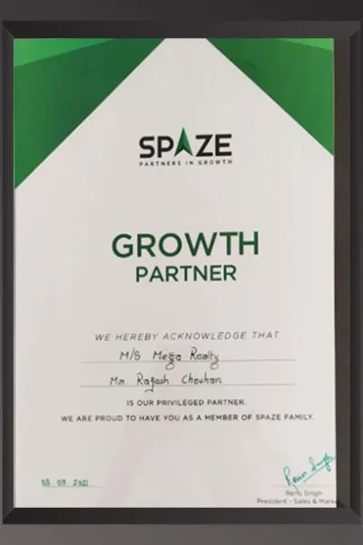 A white framed certificate from Spaze (Partners in Growth) acknowledging M/s Mega Realty and Mr. Rajesh Chouhan as a privileged Growth Partner. Signed by Renu Singh, President – Sales & Marketing, with Spaze's green and white branding.