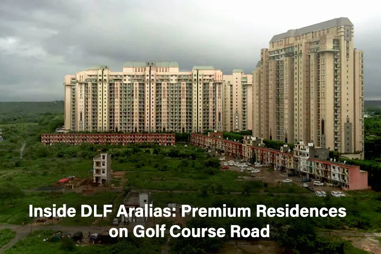 High-rise premium residential towers of DLF Aralias on Golf Course Road, Gurugram surrounded by greenery.