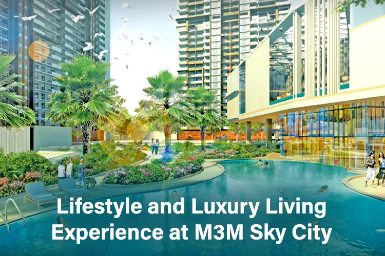 Modern high-rise residential complex at M3M Sky City featuring landscaped gardens, palm trees, vibrant flower beds, and a large swimming pool, showcasing premium lifestyle and luxury living.