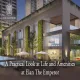 Modern luxury complex Elan The Emperor with green walls, glass architecture, and vibrant evening ambiance.