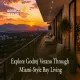 Luxurious high-rise balcony of Godrej Verano overlooking a panoramic city and mountain sunset view with modern seating and ambient lighting.