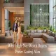 Elegant lobby interior of Godrej Alira Sector 39 Gurgaon with a couple walking through a luxurious living space featuring a green wall and premium furnishings.