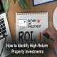 A notebook with "Return on Investment" and "ROI" written on it, with a bar chart being drawn, representing how to identify high-return property investments.