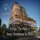 Elan The Mark luxury commercial project exterior view with modern glass facade and green landscaping in Gurugram. The white text highlights "Is Elan The Mark a Smart Investment in 2026?"
