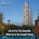 Puri The Aravallis residential towers with lush greenery and pool view at dusk in Sector 61, Gurugram.
