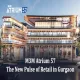 M3M Atrium 57 premium retail complex in Gurgaon featuring luxury brand stores, food court, and modern architecture at dusk.