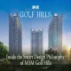 Three modern high-rise towers of M3M Golf Hills surrounded by landscaped greenery under a clear blue sky.