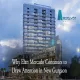 Exterior view of Elan Mercado mixed-use tower with retail and commercial spaces in New Gurgaon, featuring the Elan and PVR signage against a dramatic evening sky.