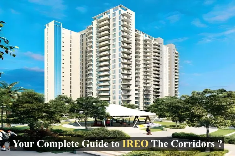 A modern high-rise apartment complex called IREO The Corridors surrounded by lush green trees and a clear blue sky, with 