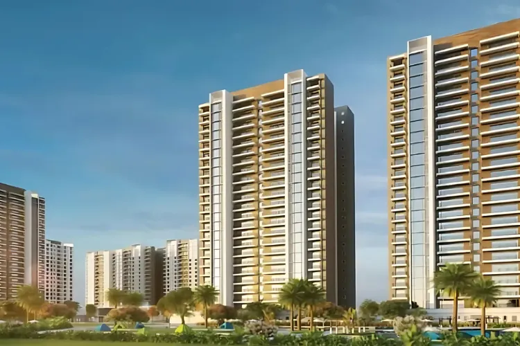 Exterior view of multiple modern high-rise residential towers at DLF Privana North, showcasing sleek architecture, numerous balconies, and green landscaping in the foreground under a clear blue sky in Gurugram.