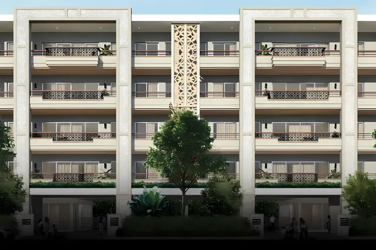 The contemporary facade of DLF The Grove residential building, featuring multiple balconies with intricate railings, ornate central design elements, and lush greenery at the base, showcasing a blend of modern and traditional architectural styles.