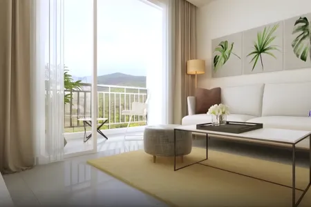 Birla Arika Living Room with Balcony and Scenic Mountain View Elegant living room at Birla Arika with white sofa, botanical artwork, and balcony overlooking greenery