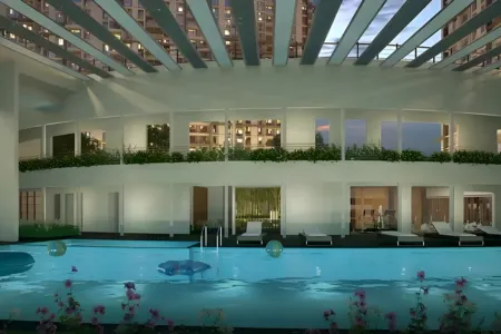 Birla Arika Indoor Swimming Pool with Skyline Views Luxurious indoor pool at Birla Arika with lounge chairs, ambient lighting, and skyline views