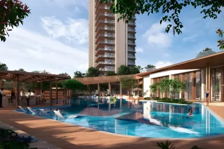 Birla Arika Poolside Retreat with Clubhouse and Tower View Luxury swimming pool at Birla Arika with submerged loungers, clubhouse, and residential tower