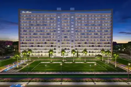 Central Park 104 – Twilight Grandeur of “The Room” in Gurugram’s Premier Residential Complex Twilight view of Central Park 104 Gurugram showcasing "The Room" residential tower with illuminated windows, landscaped gardens, and palm-lined walkways