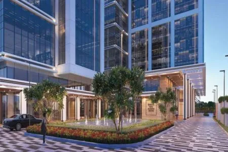 Emaar India Business Centre – Landscaped Grand Entrance and Drop-Off Zone Landscaped main entrance drop-off area of Emaar India Business Centre with glass tower facade at dusk