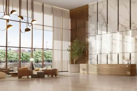 Emaar India Business Centre – Premium Reception and Welcome Lobby Bright and modern Emaar-branded reception lobby with marble walls and lush greenery