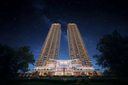 Origen Realty The Oryza - Night View of Twin High-Rise Towers Dramatic night-time architectural rendering of Origen Realty The Oryza featuring twin luxury high-rise residential towers illuminated against a clear starry sky.