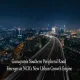 Aerial night view of Gurugram's curving Southern Peripheral Road lined with glowing street lights, leading into an illuminated city skyline of high-rise towers, with text overlay reading "Gurugram's Southern Peripheral Road Emerges as NCR's New Urban Growth Engine."