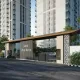 Modern entrance gate of Emaar Urban Ascent featuring sleek canopy, security barriers, and high-rise residential towers in Gurugram