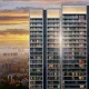 Exterior view of Godrej Verano high-rise luxury residential towers lit up against a golden sunset in Sector 63A Gurugram.