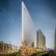 Daytime architectural rendering of M3M Capital Financial Centre (CFC) showcasing its glass tower, exterior branding, and commercial promenade