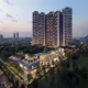 High-rise residential towers at Signature Global DXP Estate, Sector 37D Gurgaon, illuminated at dusk
