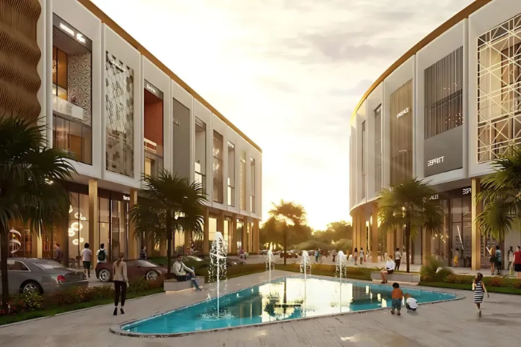 Signature Global Spectrum Square commercial complex in Gurugram featuring modern glass architecture, central water fountain, landscaped walkway, and vibrant retail and office spaces.